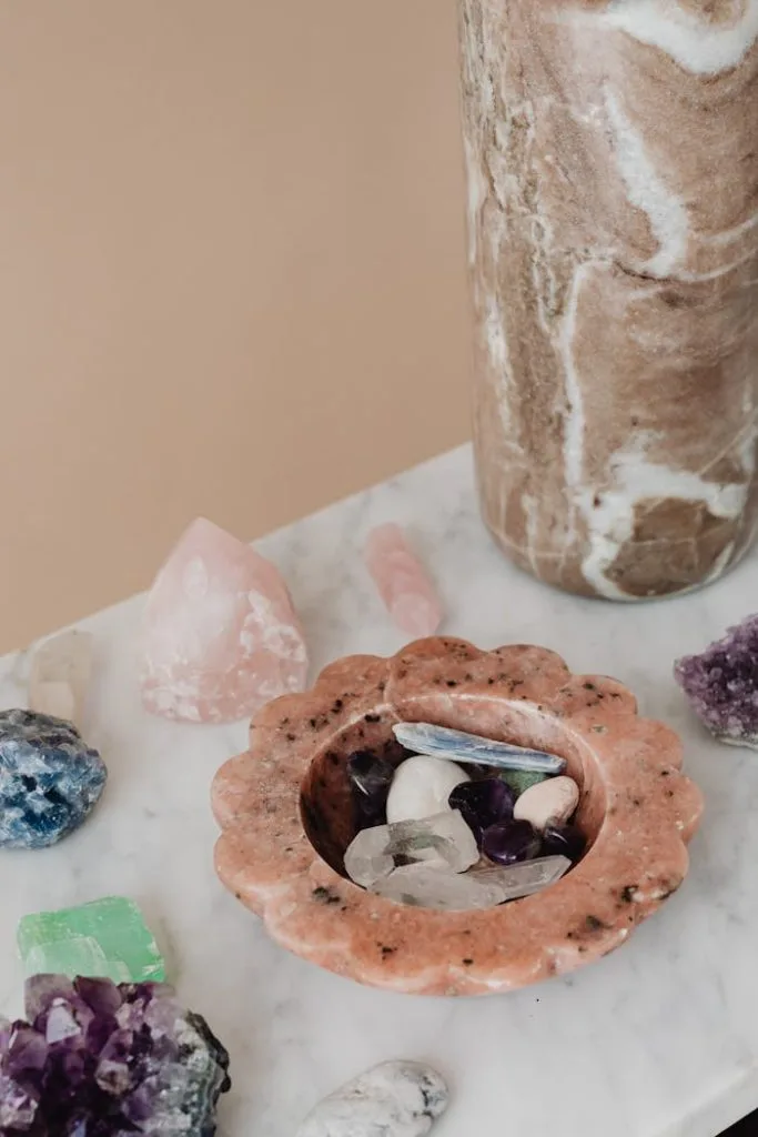 crystals-over-a-marble-top-table-6825320 Aesthetic arrangement of natural crystals and gemstones on a marble surface for decor and wellness.